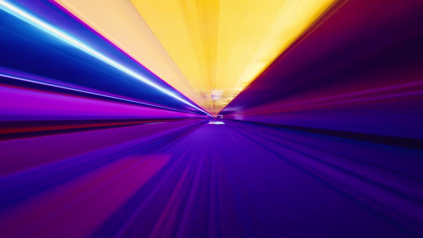 Abstract first-person view timelapse of a high-speed train ride through a colorful, futuristic subway tunnel