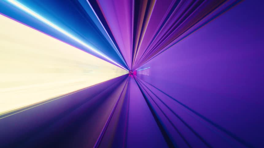 Psychedelic POV time-lapse of a journey through a futuristic subway tunnel, with colorful lights streaking by at high speed