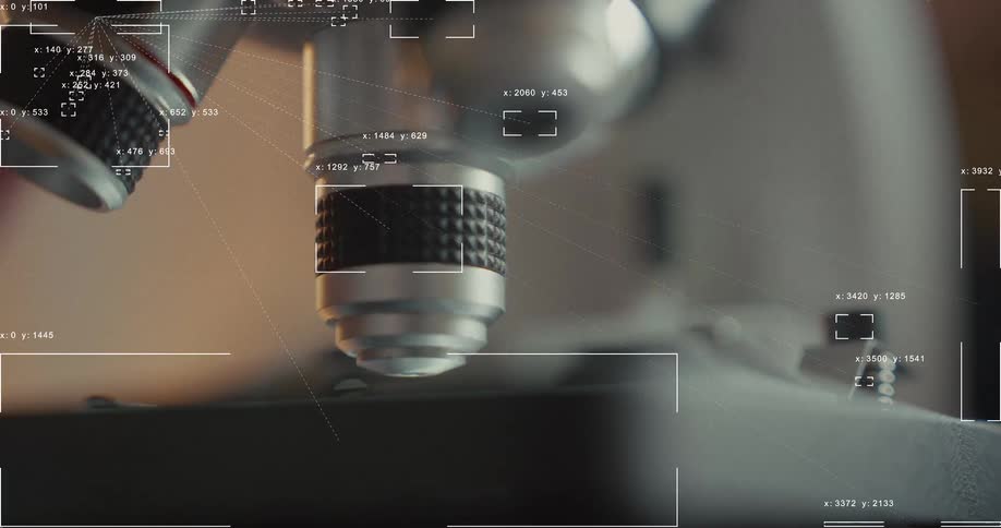 Futuristic HUD interface with data and tracking graphics overlays a close-up of a microscope being adjusted
