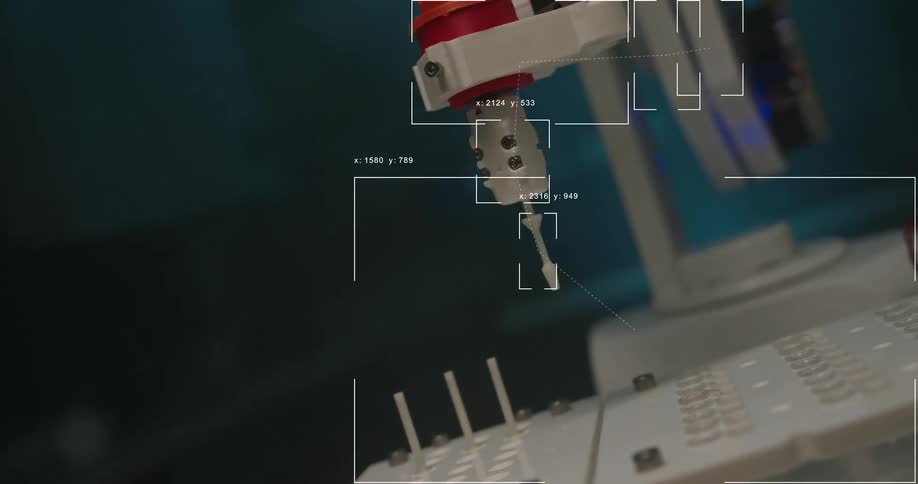 A high-tech robotic arm performs a precise automated task with digital data overlays tracking its movements