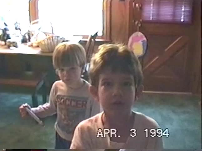 A nostalgic home video from Easter 1994 shows two young brothers talking to the camera in their living room