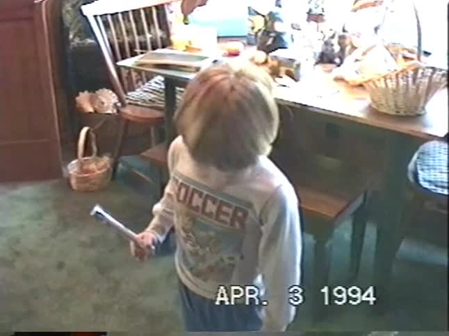 A vintage home video from 1994 shows two young boys on Easter morning before panning to their decorated Easter baskets