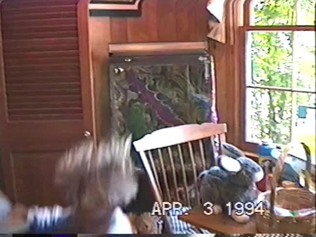 A nostalgic home video from 1994 shows a young boy excitedly opening gifts from his Easter basket