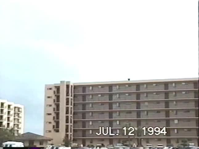 Family and kids make the most of a flooded hotel parking lot by swimming and wakeboarding in the high water in this 1994 home video
