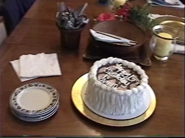 Vintage VHS home video footage of a 13th birthday cake for Simon set on a dining room table