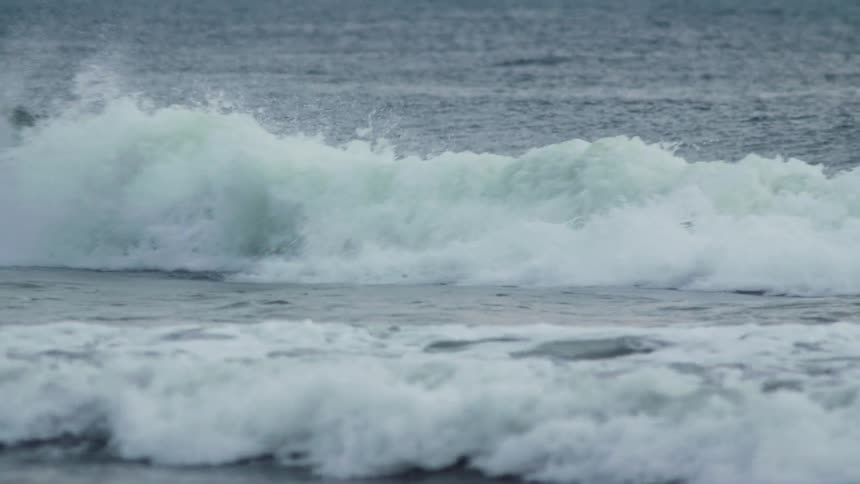 Ocean waves rolling to shore
