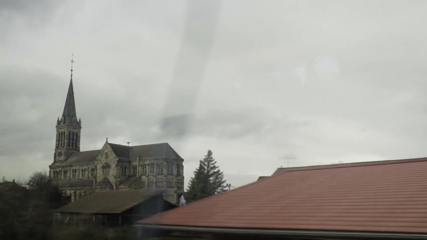 Passing by a city on a cloudy day