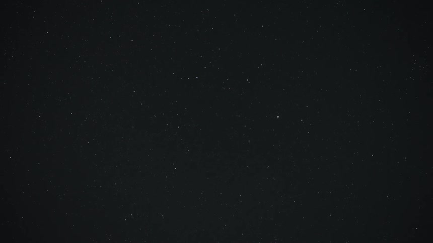 A static shot of a dark night sky filled with countless twinkling stars