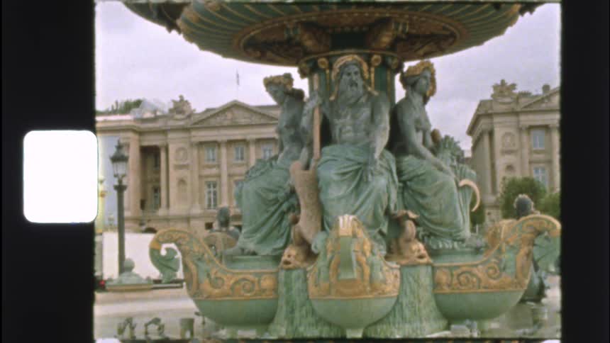 A vintage 8mm film captures the ornate details of the Fontaine des Mers at the Place de la Concorde in Paris, France