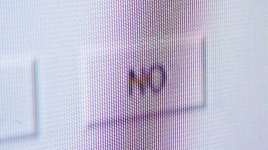 Extreme macro shot of a cursor clicking the 'NO' checkbox on a computer monitor, showing the individual pixels before the screen goes black