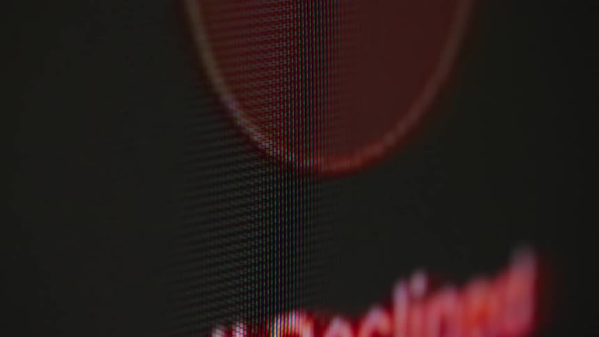 Macro shot of a digital screen showing a green 'Incoming Call' notification changing to a red 'Call Declined' message