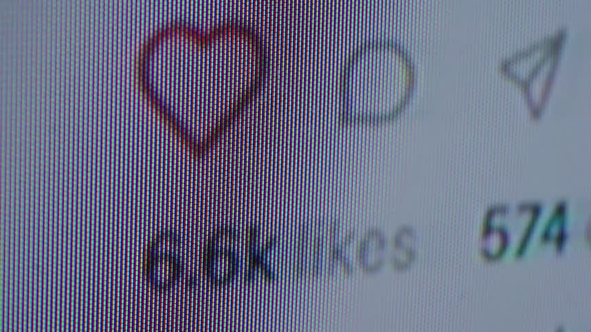 A close-up, macro view of a social media post's likes and comments rapidly increasing, symbolizing it going viral online