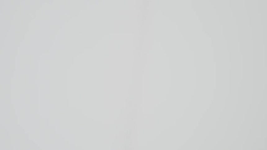A close-up, minimal animation of a white chat bubble with three blinking dots, indicating someone is typing a message