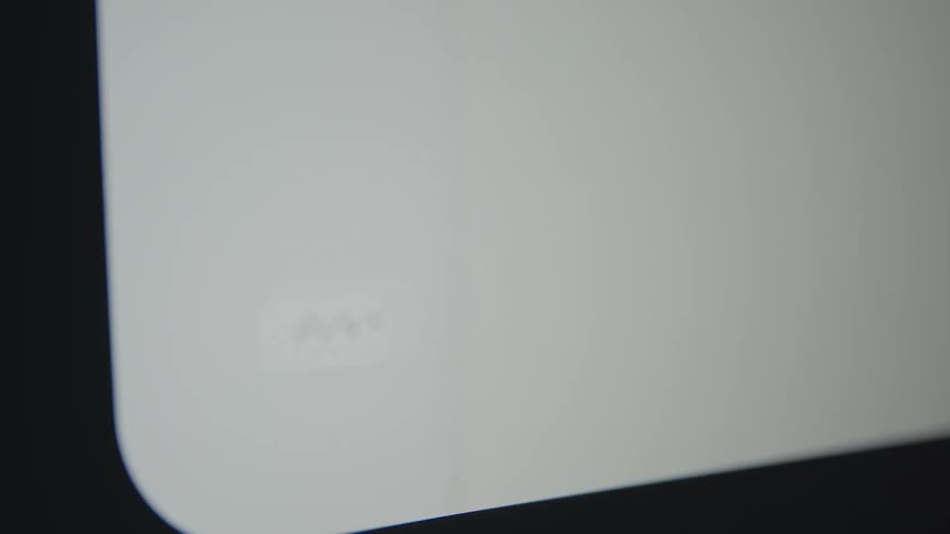 A close-up shot of an animated icon showing three blinking dots in a message bubble on a digital screen, indicating someone is typing