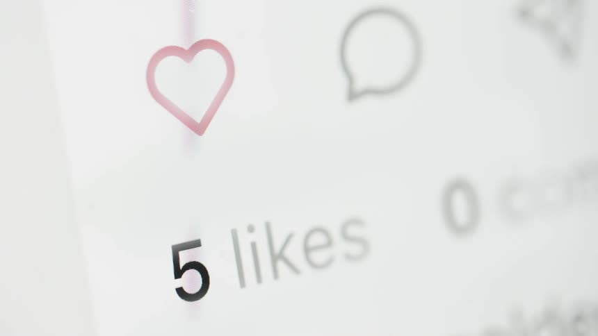 A close-up of a social media like counter rapidly increasing, symbolizing growing popularity and viral content