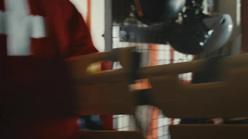 A ski patrol paramedic urgently grabs a yellow stretcher from the equipment room during an emergency