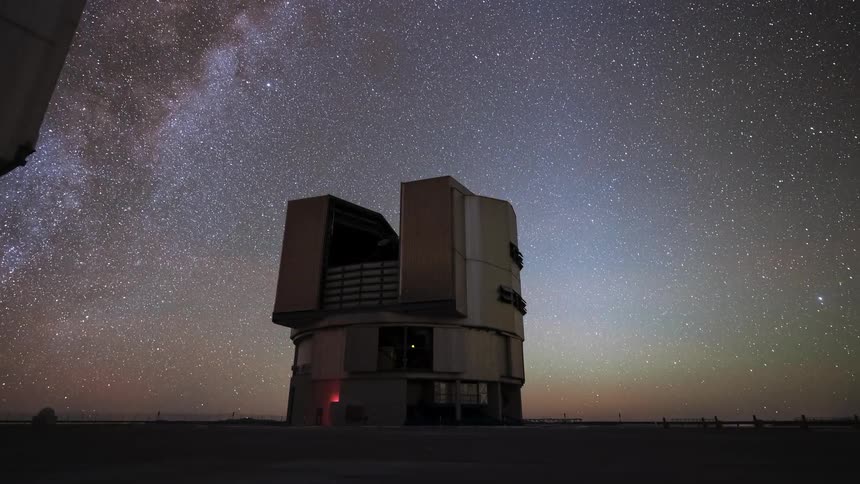 A breathtaking timelapse shows an astronomical observatory dome opening and rotating under a spectacular night sky filled with the moving Milky Way and stars