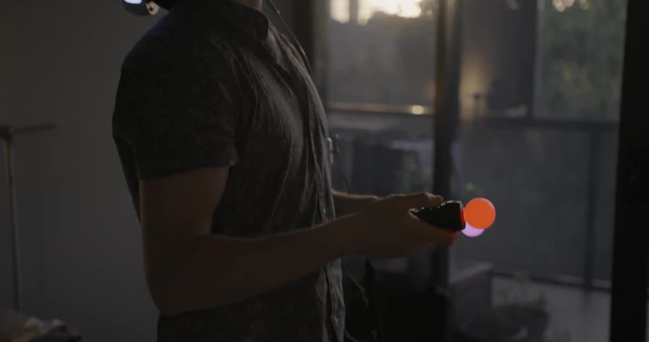 A man using a virtual reality headset is looking in all directions slowly