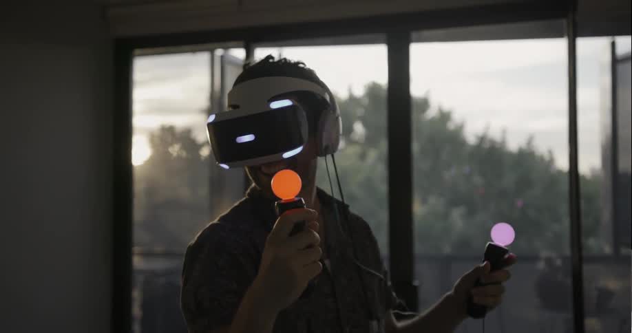 Man playing with a virtual reality machine