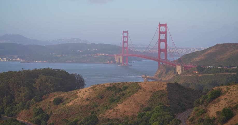 A scenic high-angle pan across the Marin Headlands showcases the iconic Golden Gate Bridge and the San Francisco Bay