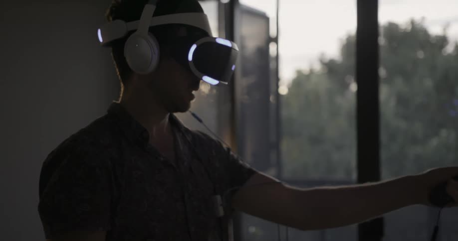A man is using virtual reality equipment