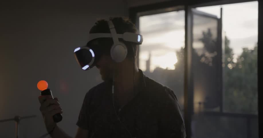 A man plays with a vr headset