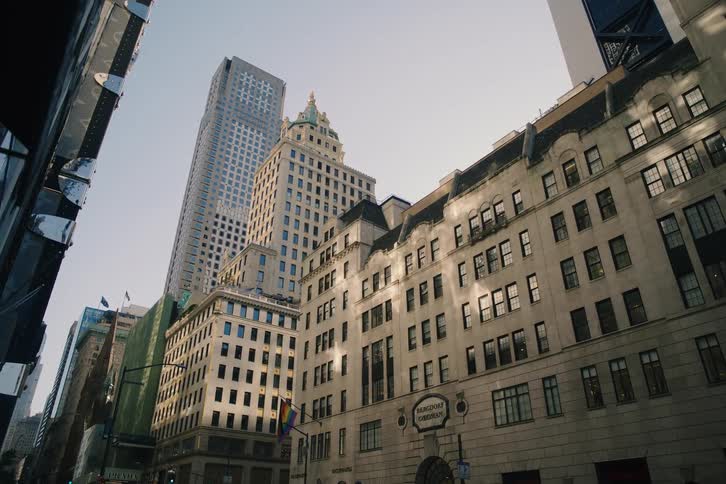 Sunlight moves across the iconic facades of historic and modern buildings in midtown Manhattan