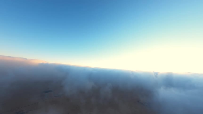 A pull-back shot from a hot air balloon basket reveals two people filming the breathtaking sea of clouds below at sunrise
