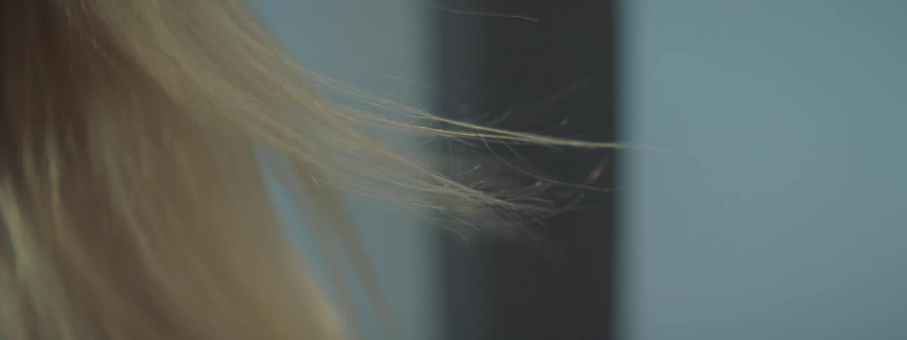 A woman's hair blows in the wind