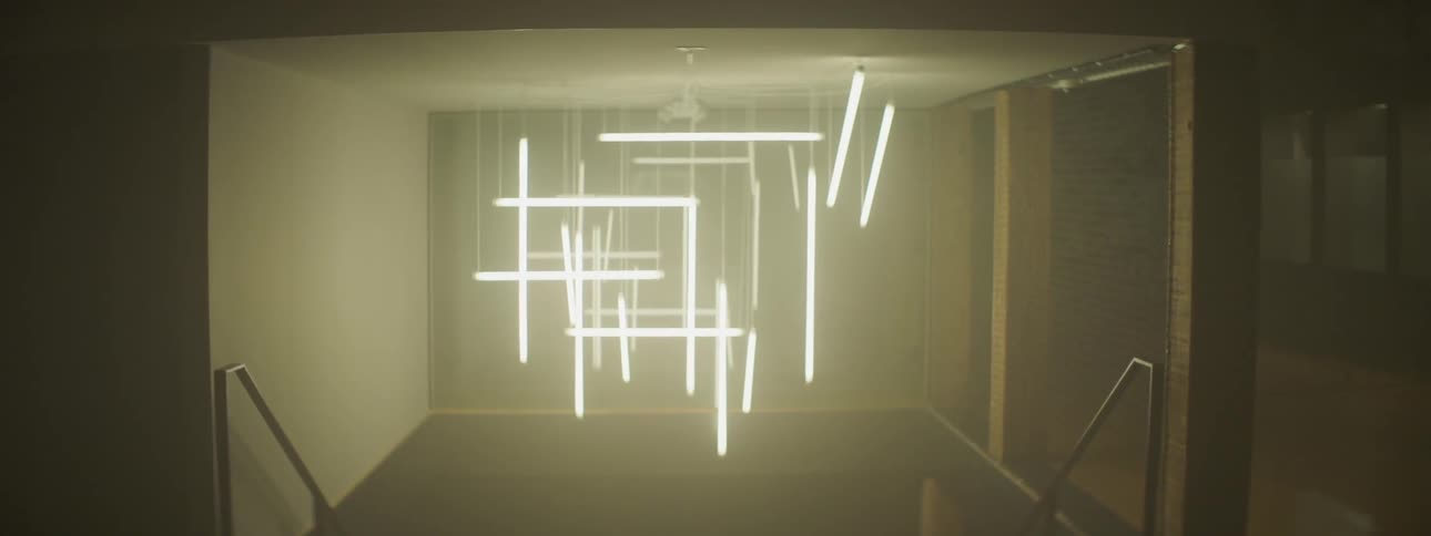 Long fluorescent light bulbs hanging in a room