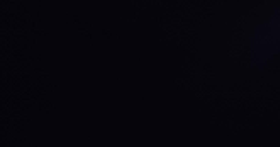 Ominous lightning strikes and flashes intermittently illuminate the stormy night sky