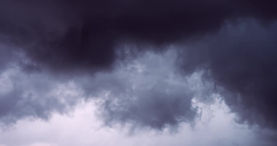 Dramatic lightning strikes illuminate the dark and ominous clouds of a powerful thunderstorm