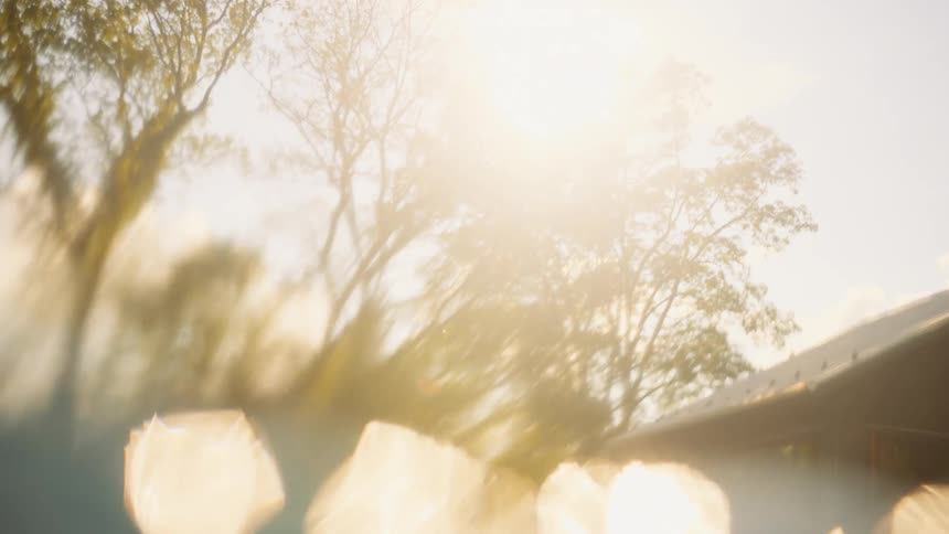 Dreamy abstract transition from dark underwater depths to a bright sunlit sky with beautiful bokeh