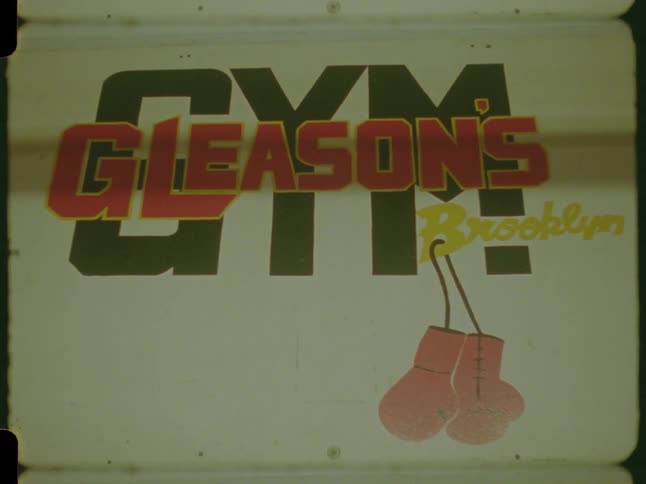 A vintage archival shot of the Gleason's Gym sign in Brooklyn, New York, featuring its classic logo and boxing gloves