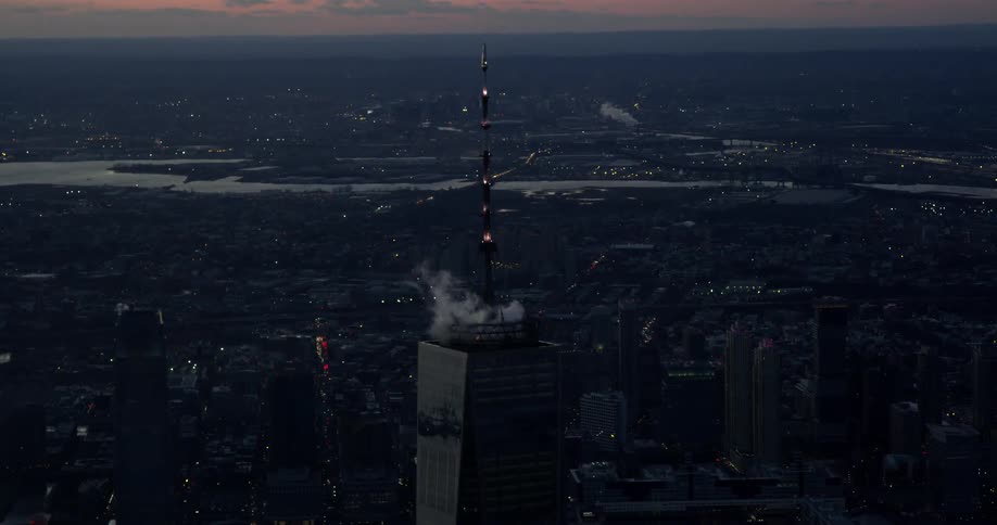 Aerial view of building in New York City skyline during sunset
