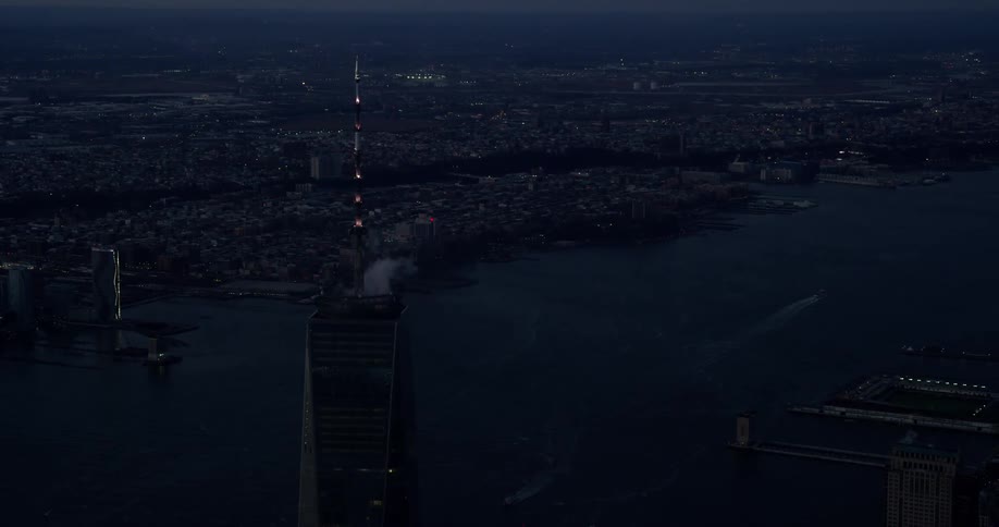 A tall tower sits in this city at night
