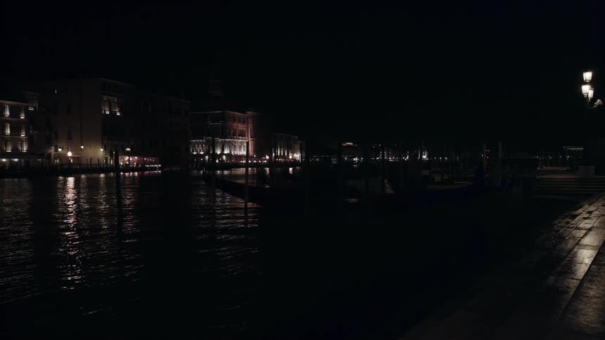 River flowing through a city at night