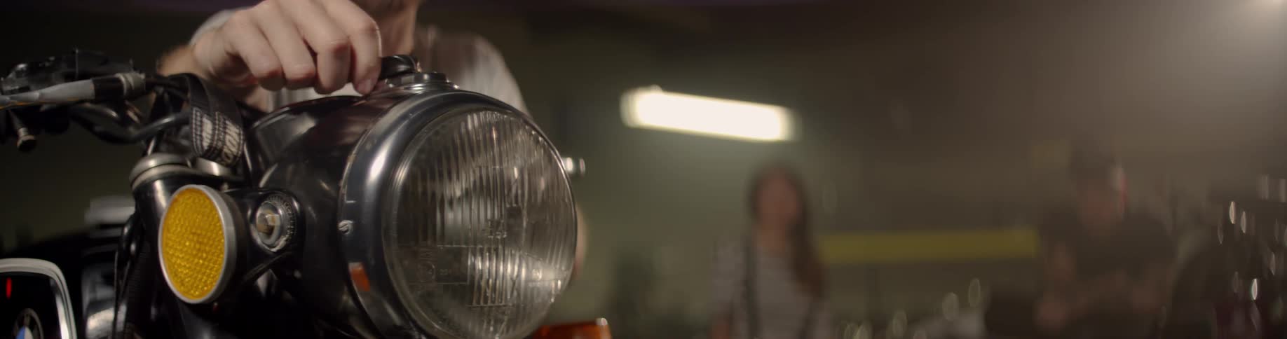 A person turns on a headlight
