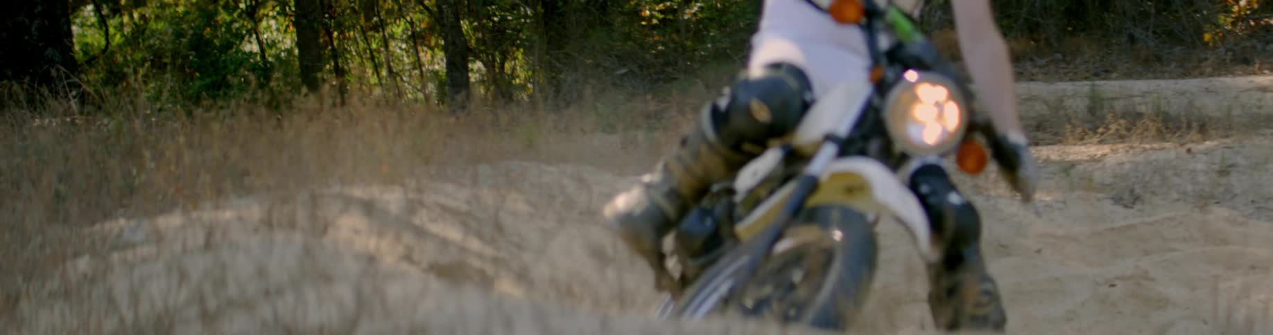 Dirt bike rides on a sandy beach