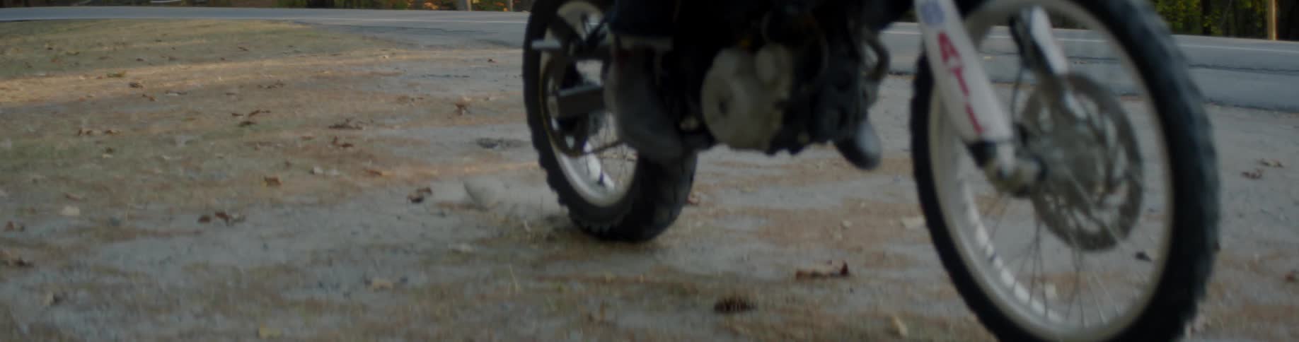 Motorbike taking off down a road