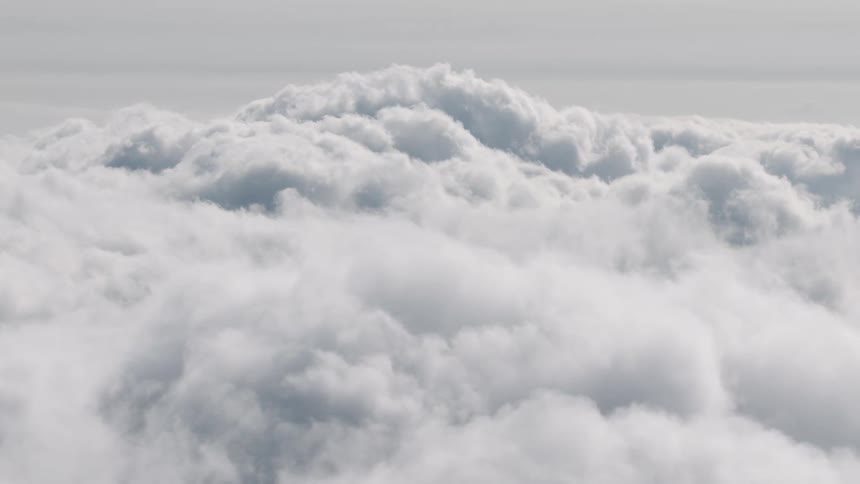 A serene and peaceful view from above a vast sea of fluffy white clouds