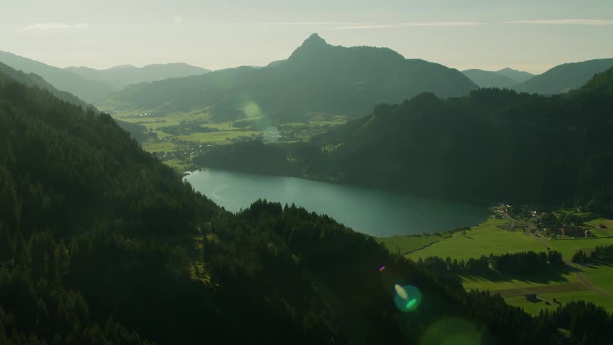 Lake surrounded by trees and mountains