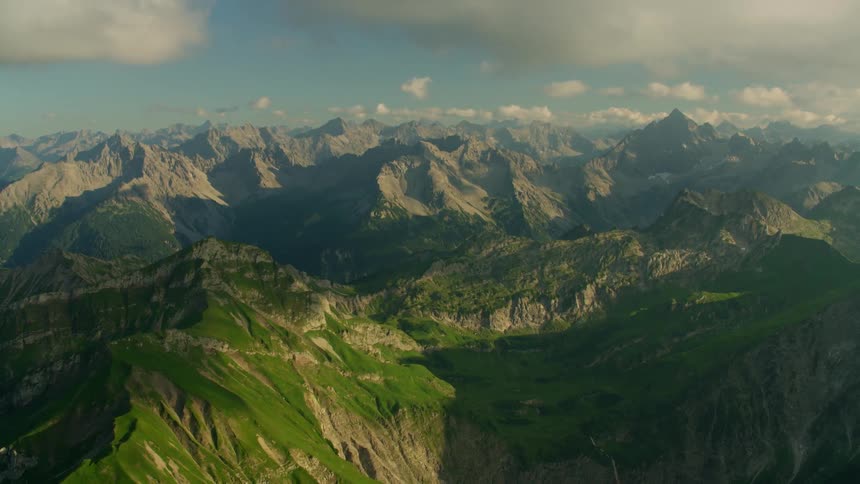 Clouds over the jagged peaks of a mountain range