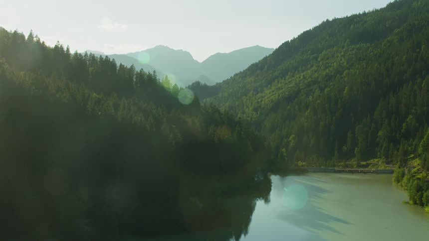 River flowing through mountains on a sunny day