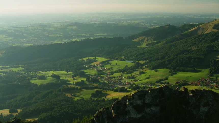 A mountain valley is shown on a sunny day