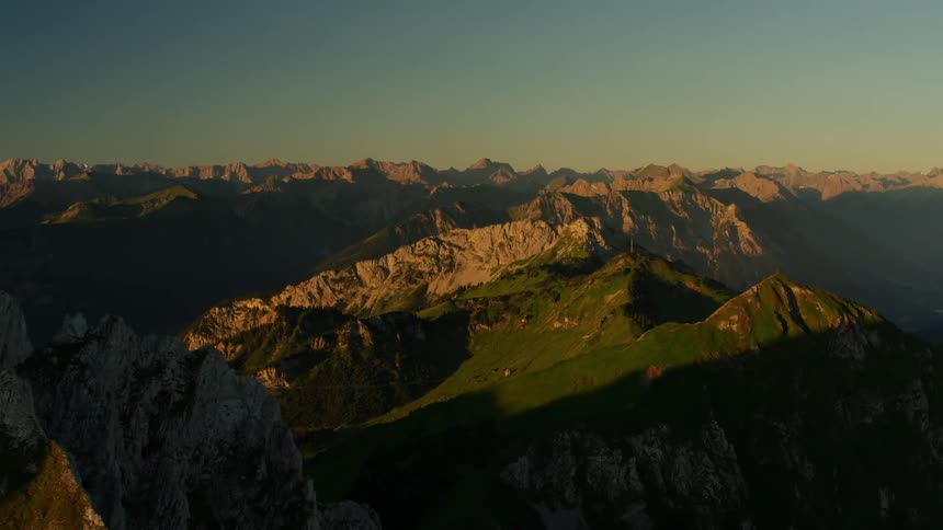 Mountains are shown at sunset
