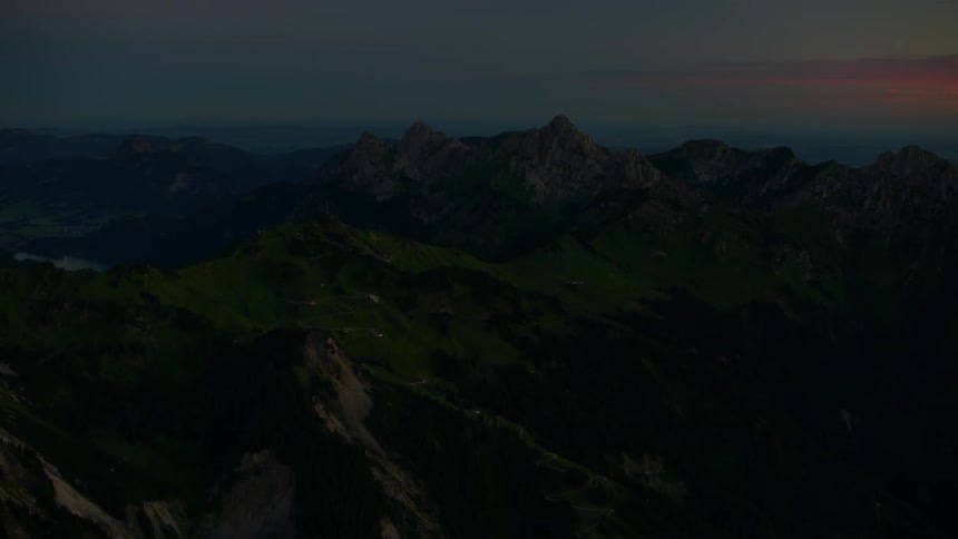 Mountains are shown from above at sunset
