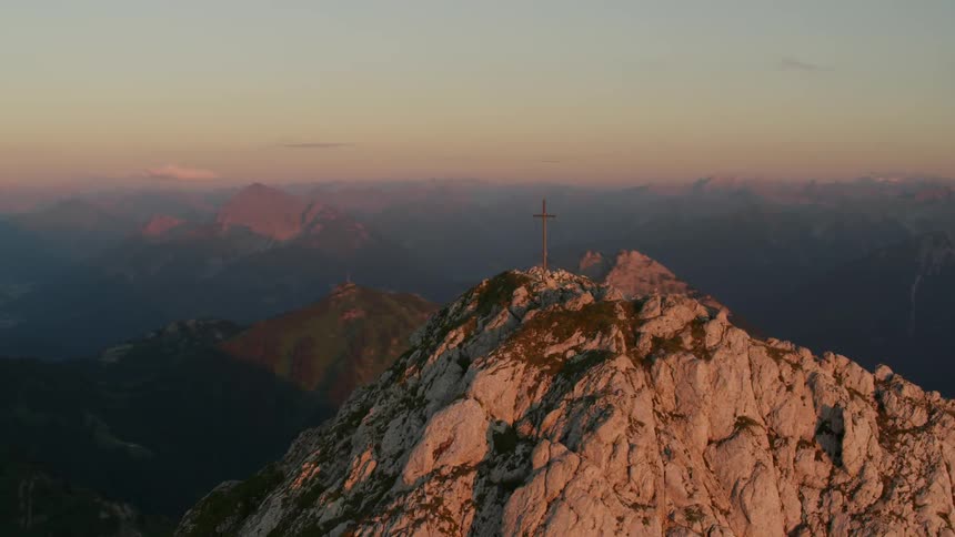 A cross on a rocky mountain