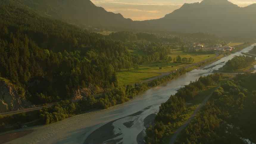 River flowing through mountains and plains