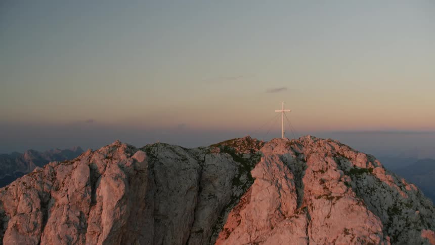 A cross on a tall mountain